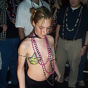 Mardi Gras lovelies baring all body painted women exposing breasts