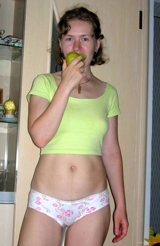 Julia Munches a Little Green Pear While She Exposes Her Larger Pair