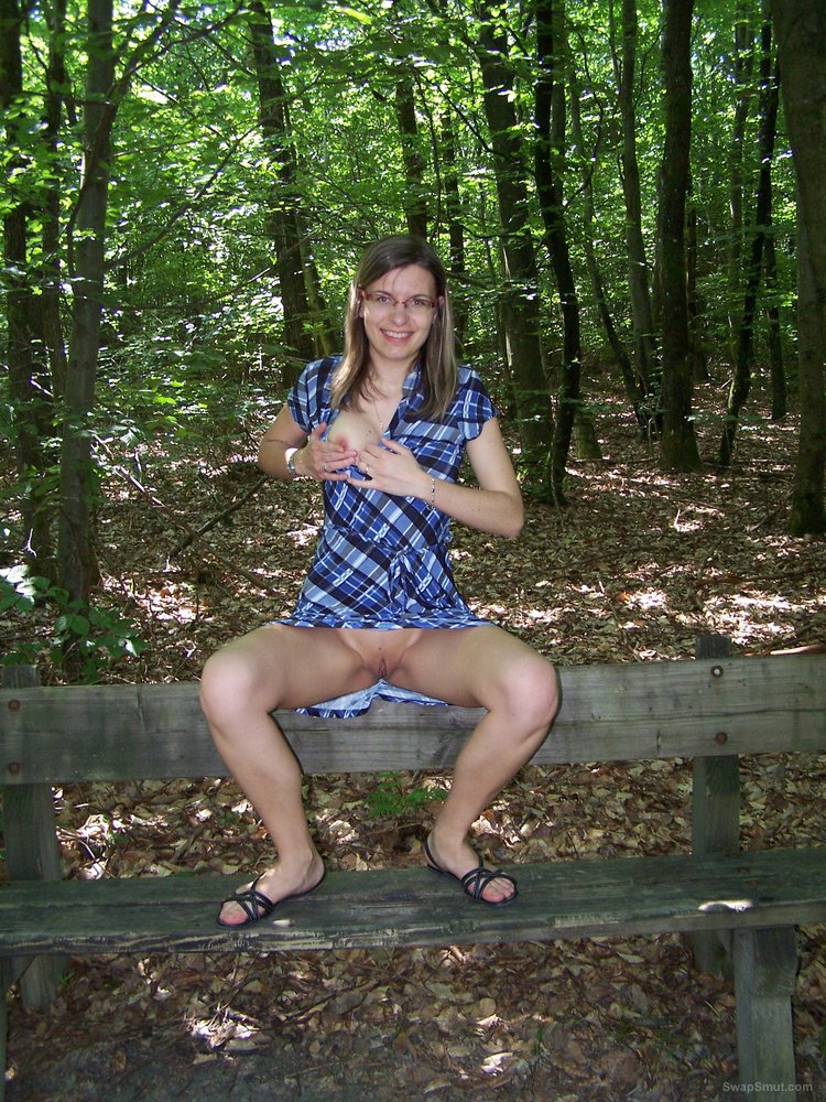 Showing her cunt in the woods