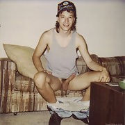 Twink Jean-Luc Nude and erect sitting on the couch with a hardon