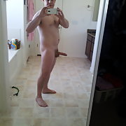 Standing around naked with an erection taking self shot amateur photos