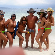 Latin MILFS at the beach show their tits