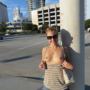 Wife flashing her breasts in public
